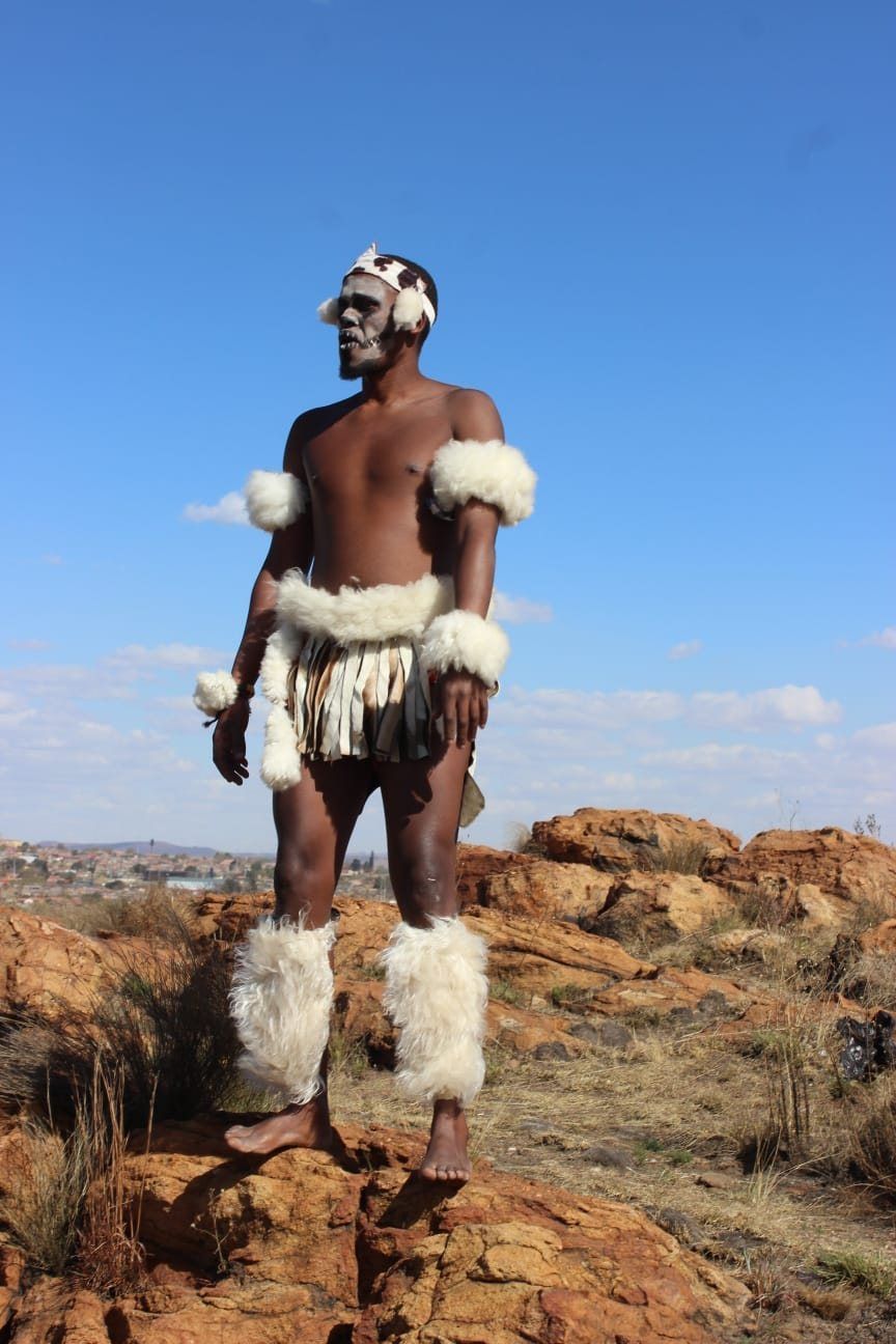 Traditional Zulu performer at a South African cultural village