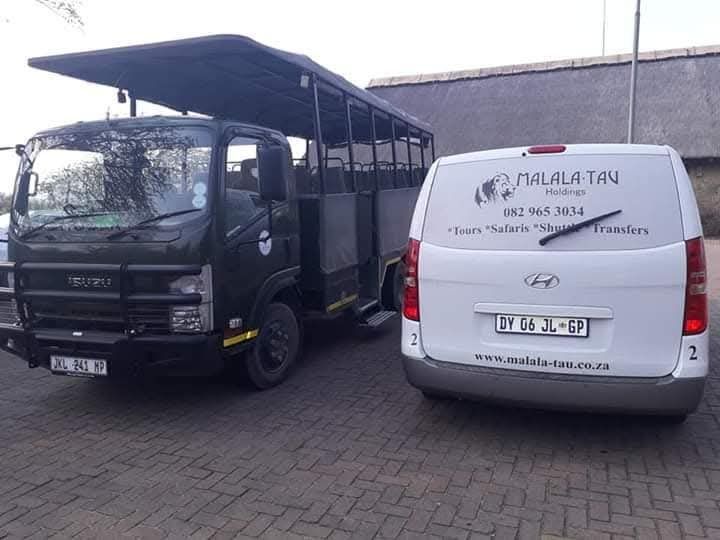 Malala-Tau shuttle and open game viewer ready for a transfer and safari