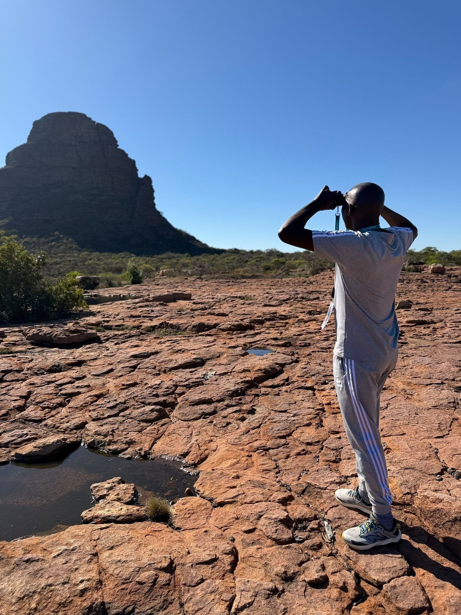 Photographer below the sandstone formations at Makgabeng, Limpopo