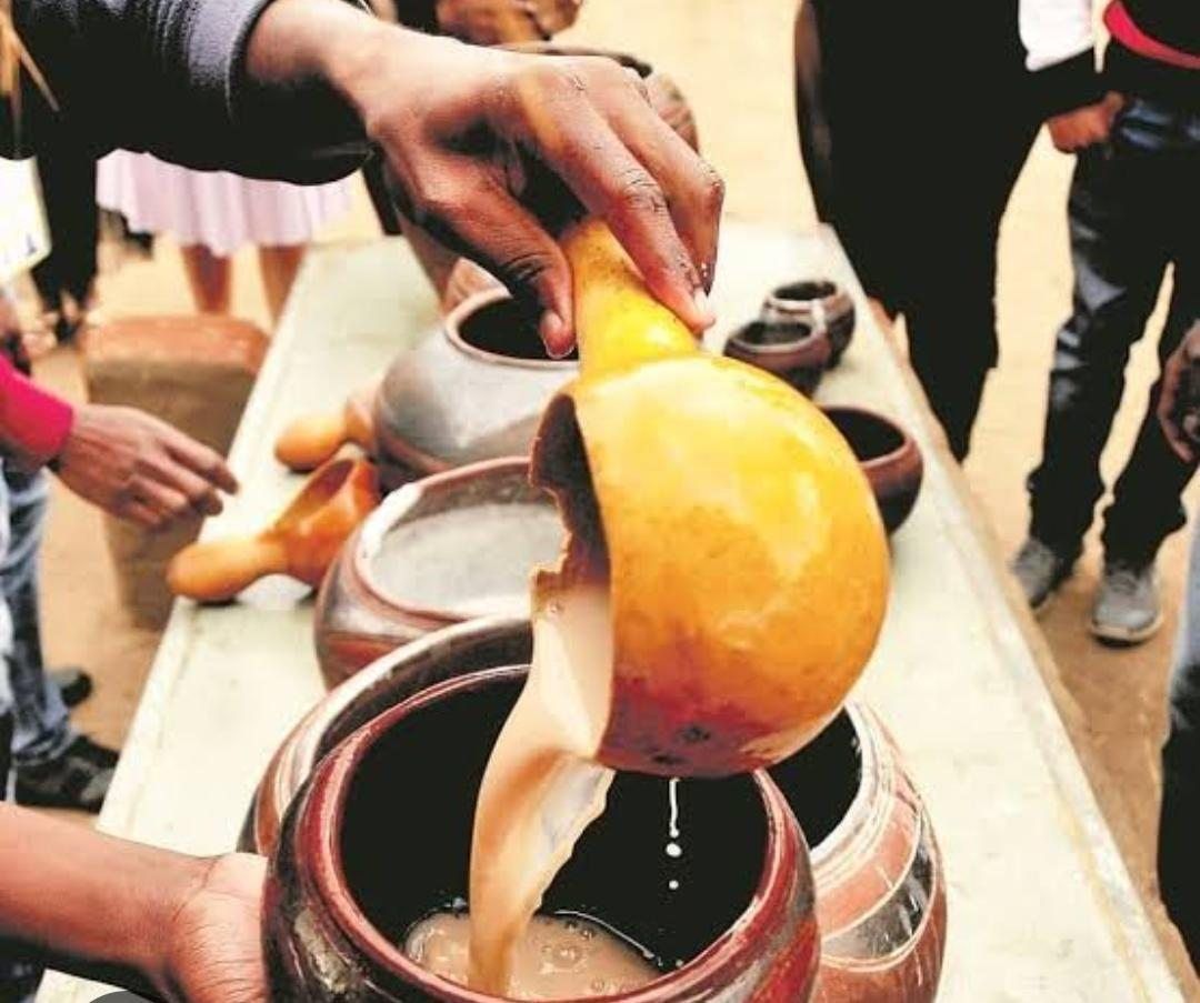 Traditional umqombothi poured from a calabash on a Soweto heritage tour