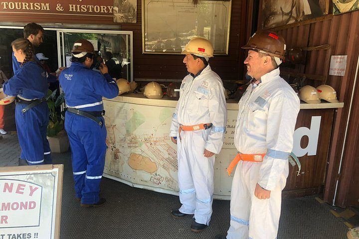 Guides in mining gear at the Cullinan Diamond Mine tour desk